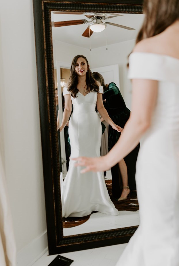 Bride wearing Josie wedding gown by Rebecca Ingram, which works wonderfully for winter wedding themes