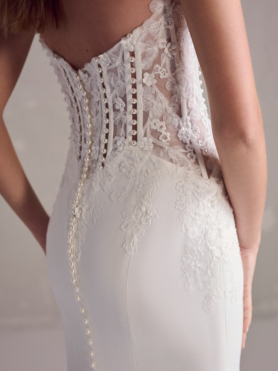 Bride wearing pearl wedding dress called Doritte by Maggie Sottero