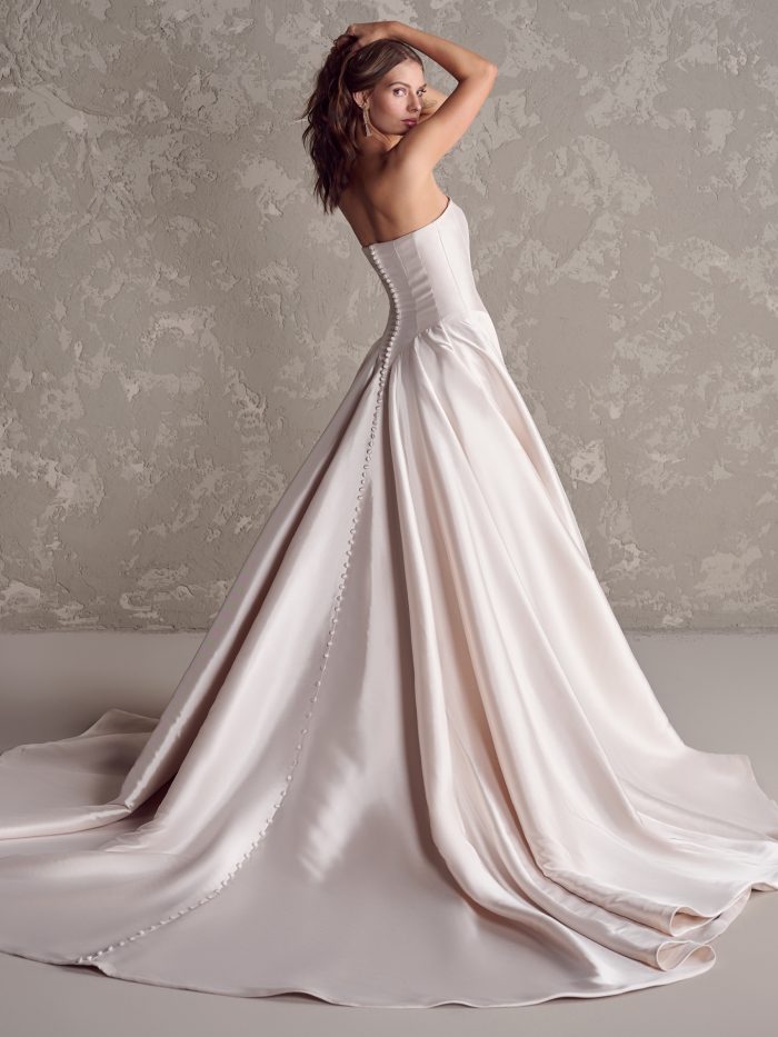 Bride wearing drop waist wedding dress Emmanuelle by Maggie Sottero