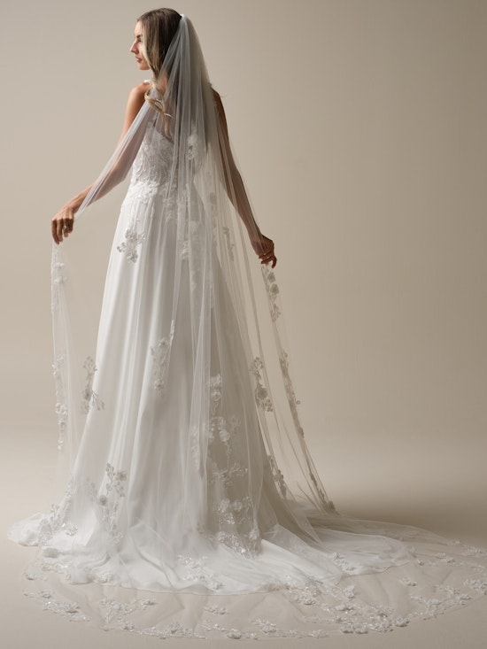 Bride wearing pearl wedding dress called Hunter by Maggie Sottero