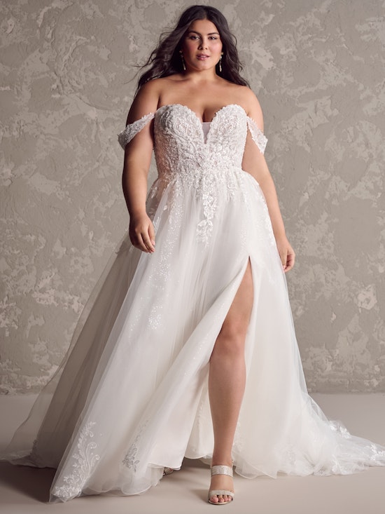 Bride wearing pearl wedding dress called Marguerite by Maggie Sottero
