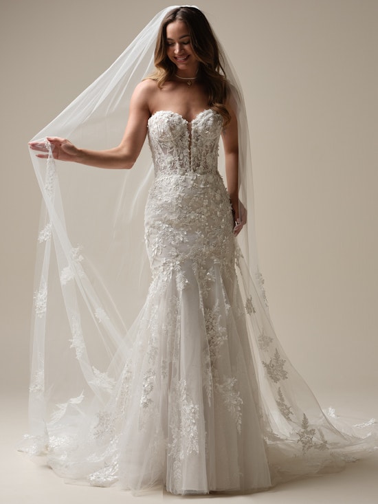 Bride wearing pearl wedding dress called Roberta by Maggie Sottero