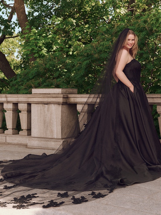 Bride wearing drop waist wedding dress Serafina by Maggie Sottero