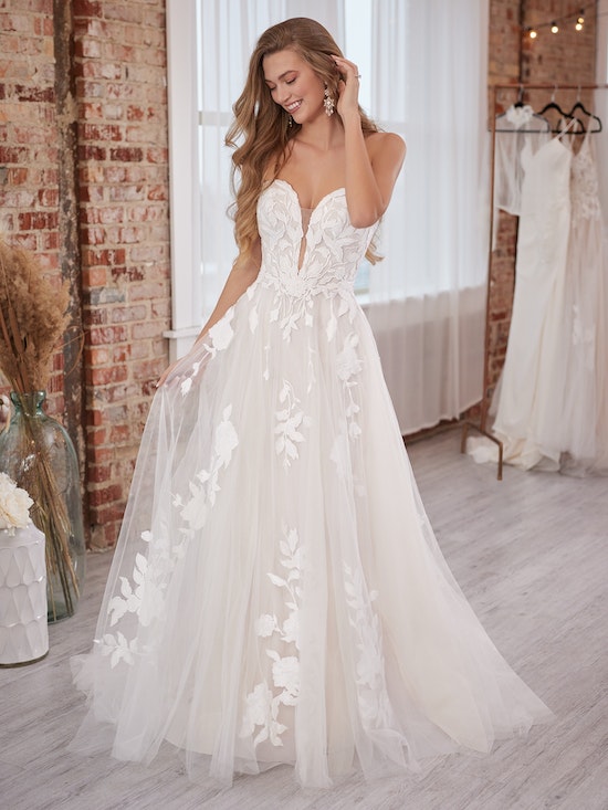 Bride wearing Hattie Lane Marie wedding dress by Rebecca Ingram