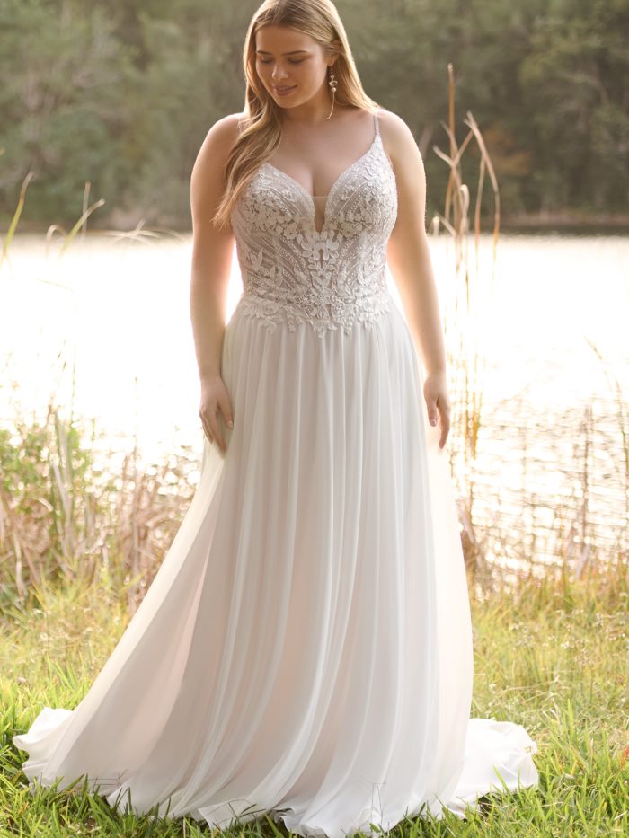 Bride wearing Finley by Rebecca Ingram, a flowy a-line gown with a beaded lace bodice