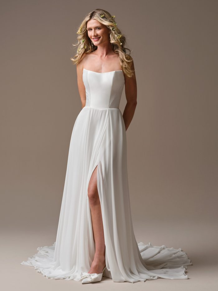 Georgina by Rebecca Ingram A-line wedding dress with sheer long-sleeve floral lace bodice and flowing chiffon skirt, front view