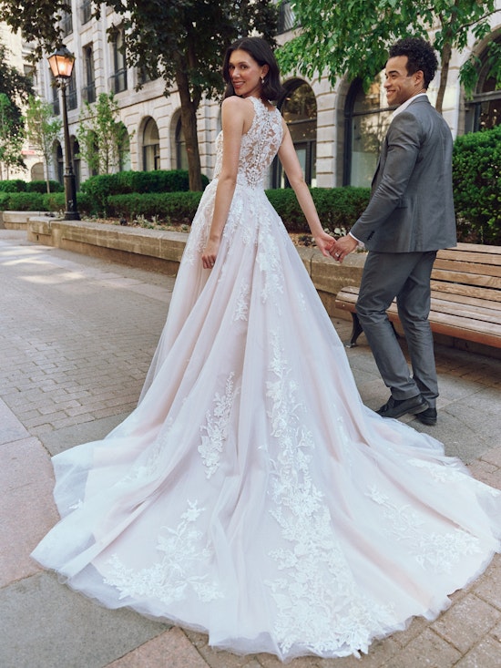 Bride wearing pearl wedding dress called Rickie by Rebecca Ingram