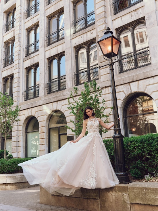 Bride wearing pearl wedding dress called Rickie by Rebecca Ingram