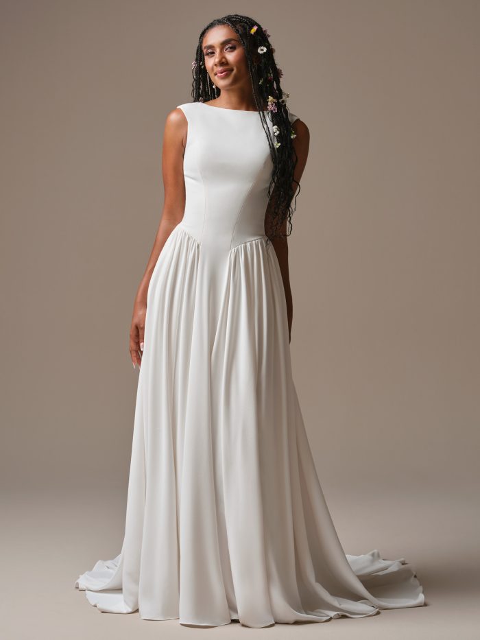 Shay by Rebecca Ingram — minimalist crepe A-line wedding dress featuring a bateau neckline, natural waist, and effortless flowing skirt.