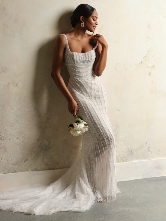 Bride wearing pearl wedding dress called Danica by Sottero and Midgley