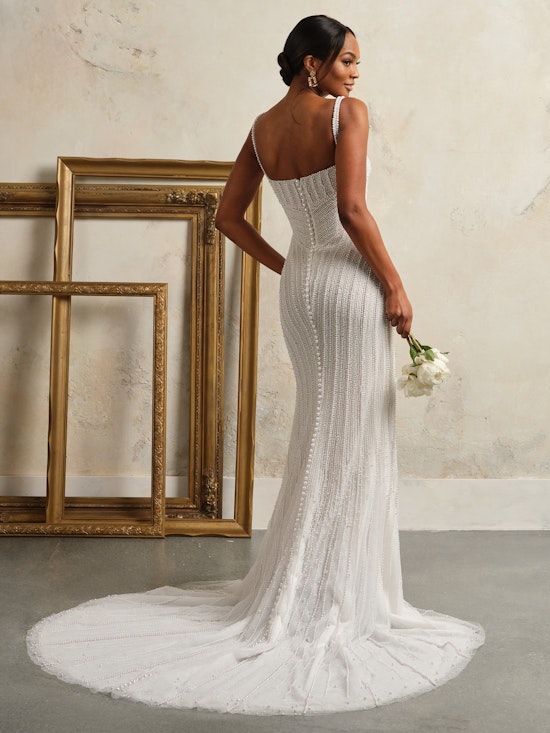 Bride wearing pearl wedding dress called Danica by Sottero and Midgley