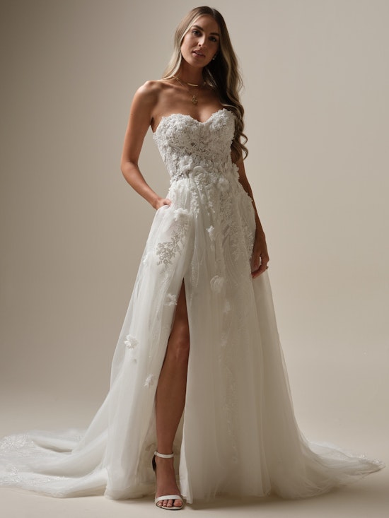 Bride wearing a tall slit floral wedding dress