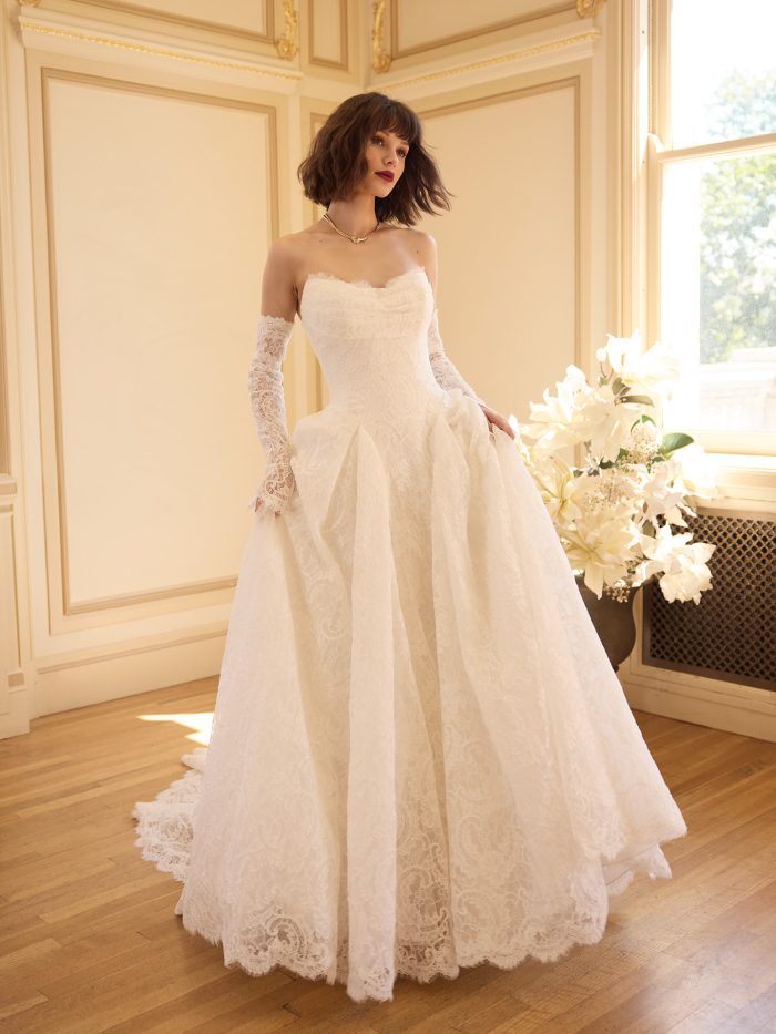 Sottero and Midgley Tamar A-line wedding dress featuring a strapless lace bodice, detachable illusion lace sleeves, and a full A-line skirt with soft lace detailing.