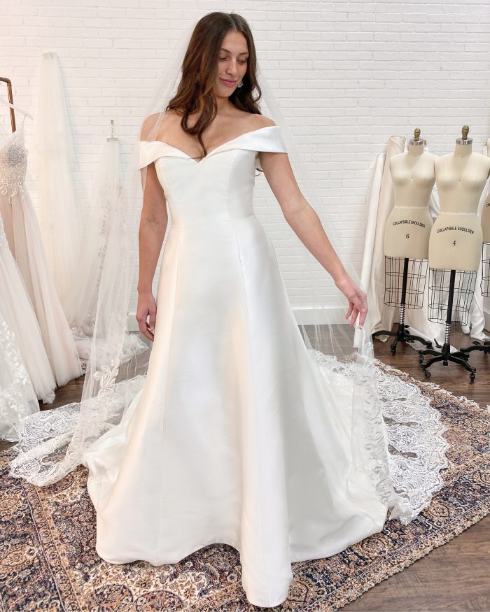 Bride Wearing Satin A-line Wedding Dress Called Coral by Rebecca Ingram at Wedding Dress Fitting