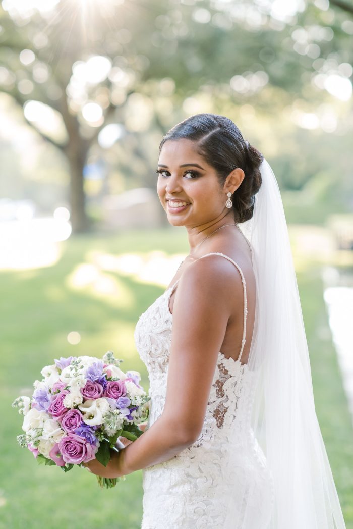 Bride wearing Tuscany Royale wedding dress by Maggie Sottero