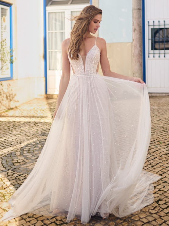 Bride wearing Betsy wedding dress by Maggie Sottero